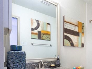Designer touches include framed vanity